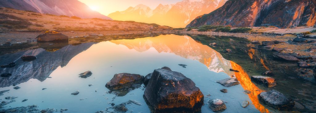 Beautiful,Landscape,With,High,Mountains,With,Illuminated,Peaks,,Stones,In